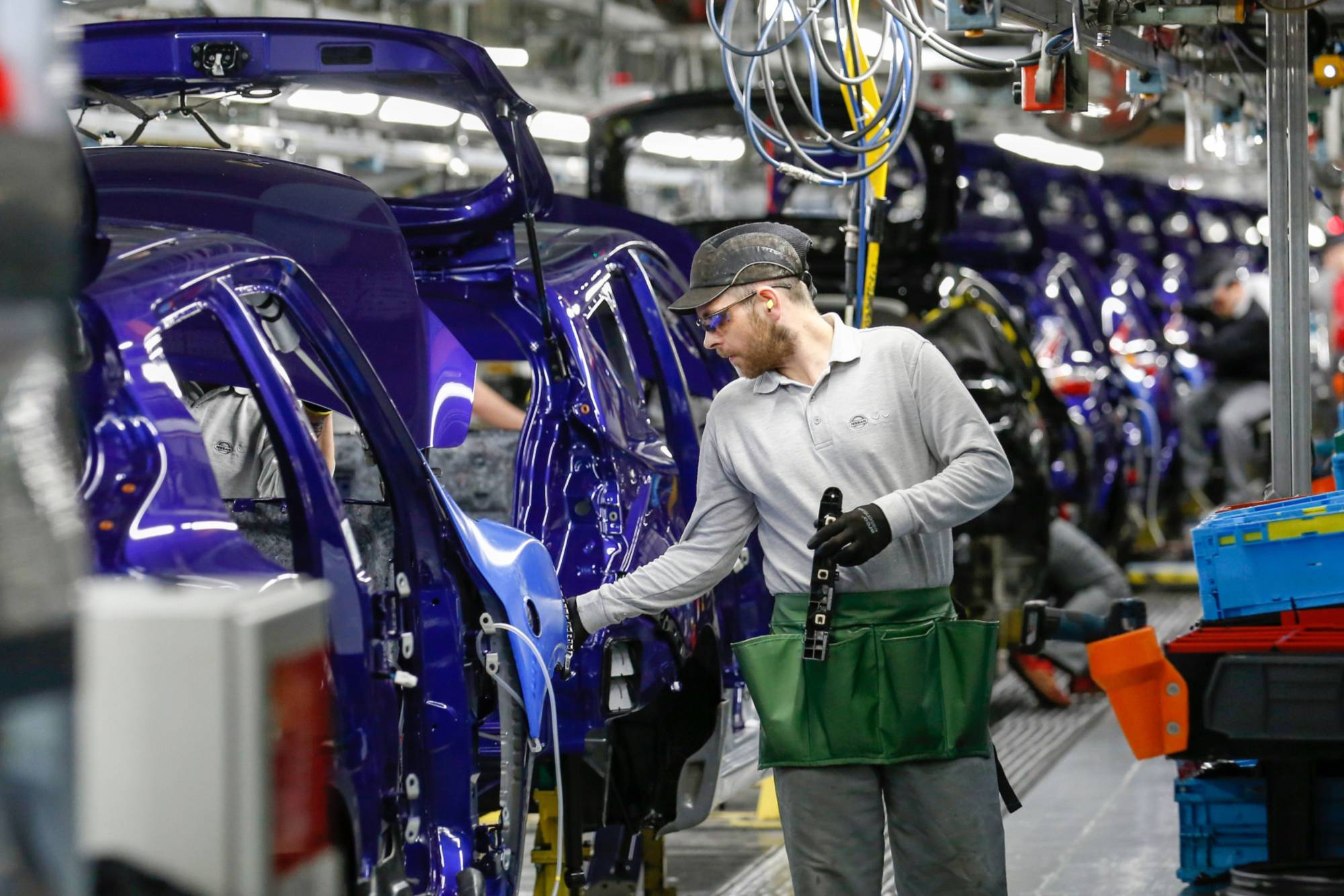 The production line at the Nissan Motor Co. plant in Sunderland, U.K. The company recently decided against making an electric model at its Northern England factory and almost two years ago scrapped plans to build another sport utility vehicle at the same site. | BLOOMBERG 